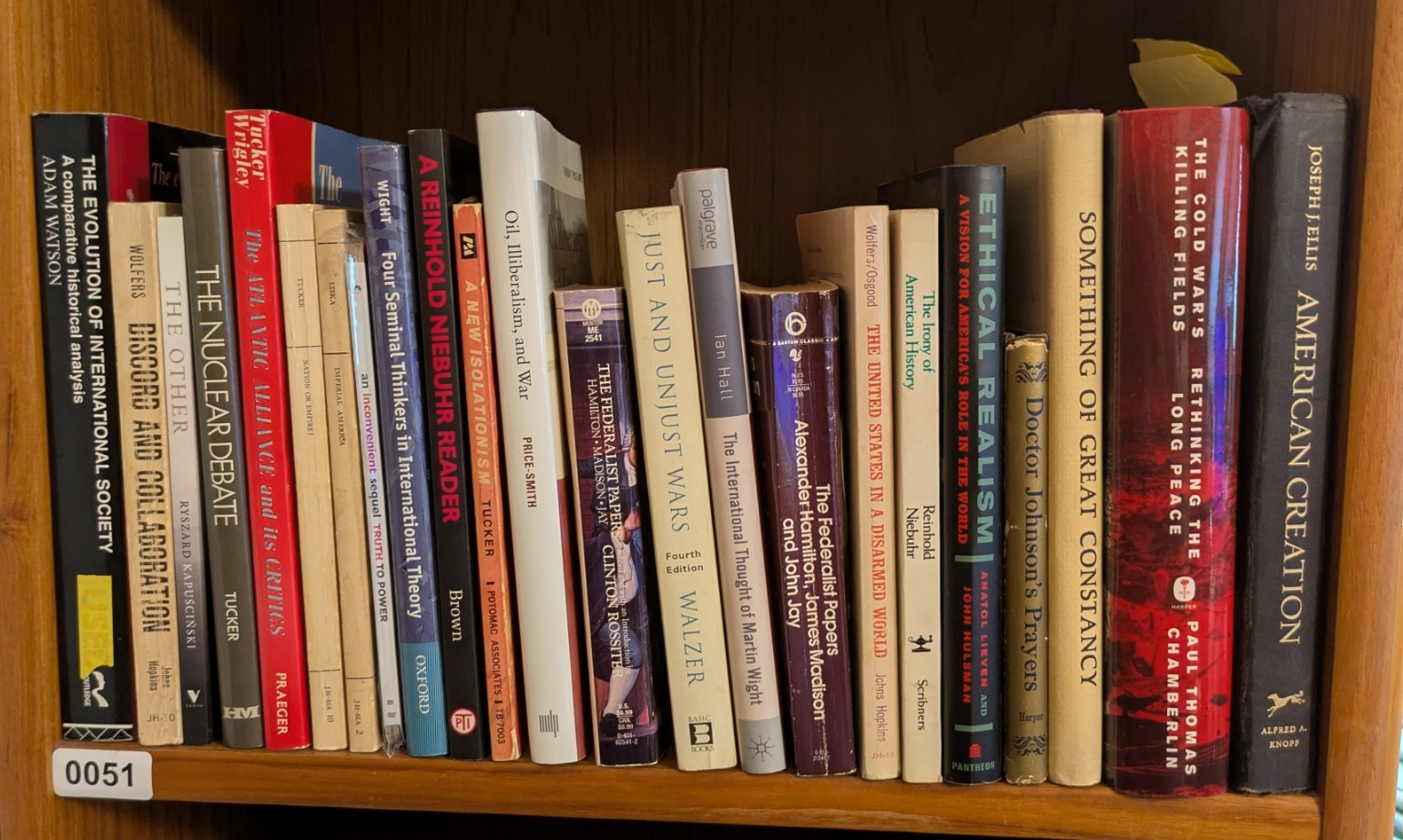 Photograph of Shelf 51 with readable book spines.