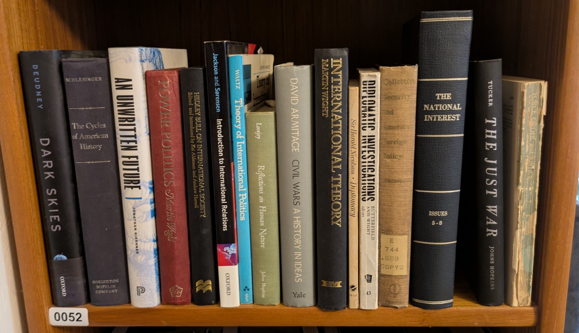 Photograph of Shelf 52 with readable book spines.