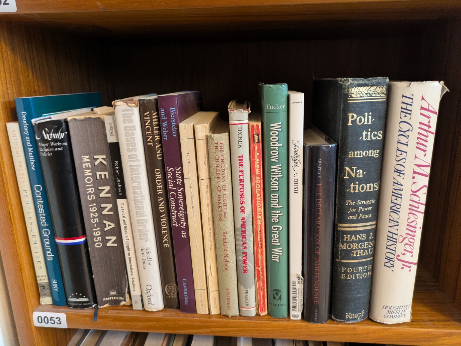 Photograph of Shelf 53 with readable book spines.