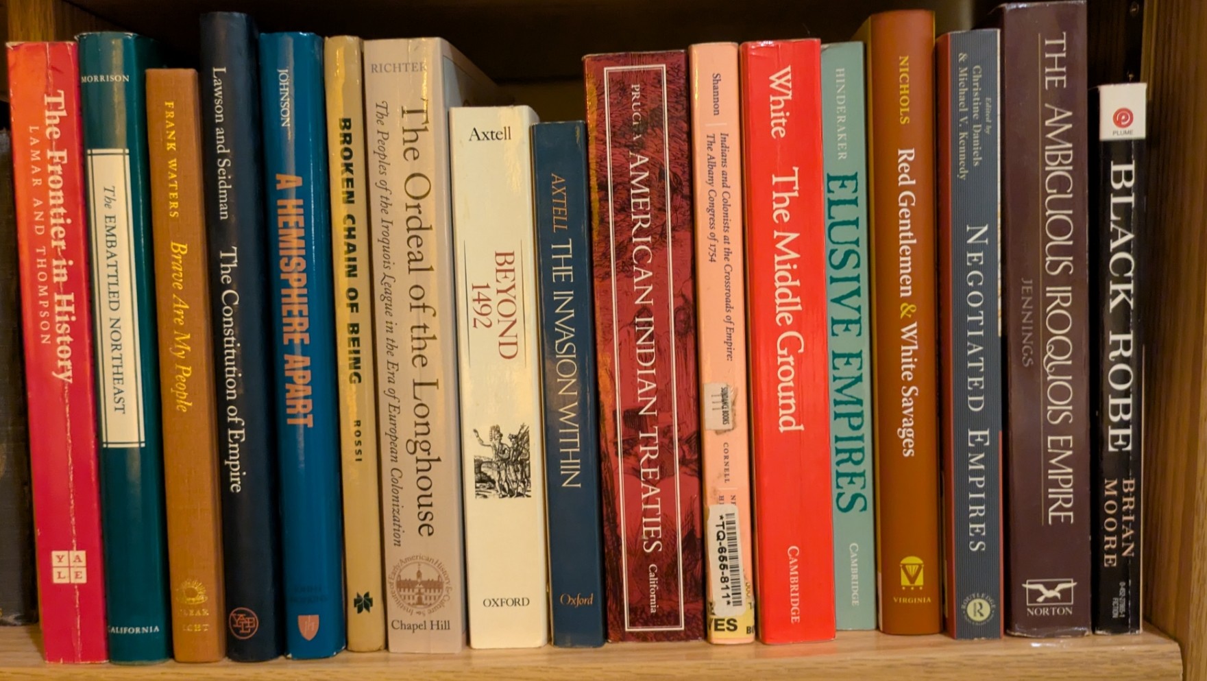 Photograph of Shelf 157; books are listed in top-to-bottom order alongside the photograph.