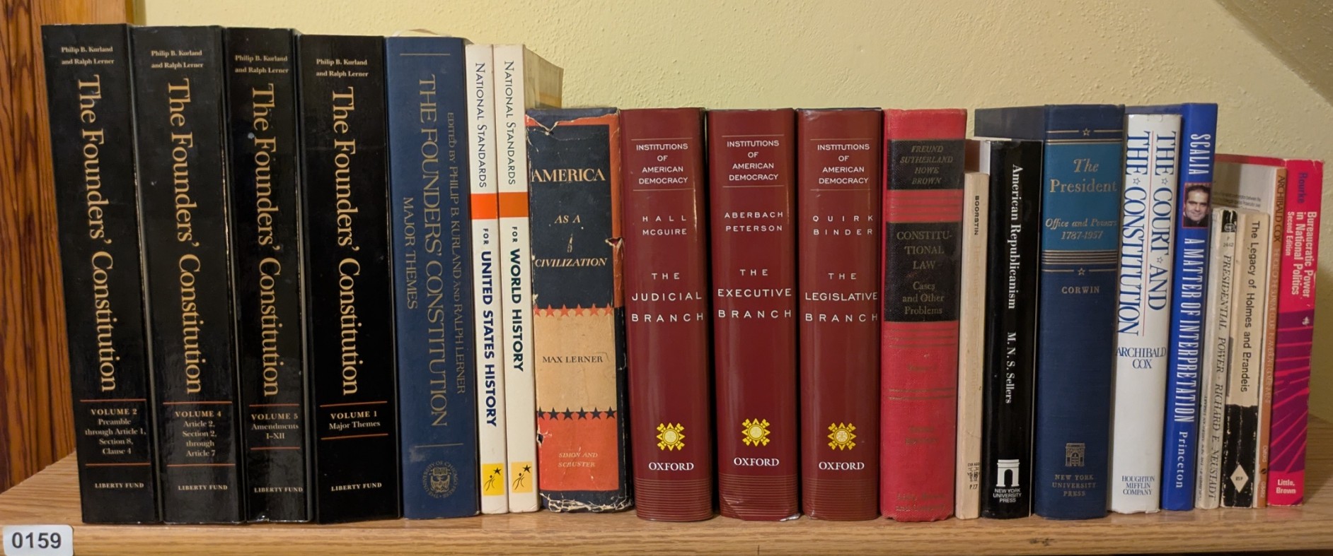 Photograph of Shelf 159; books are listed in top-to-bottom order alongside the photograph.