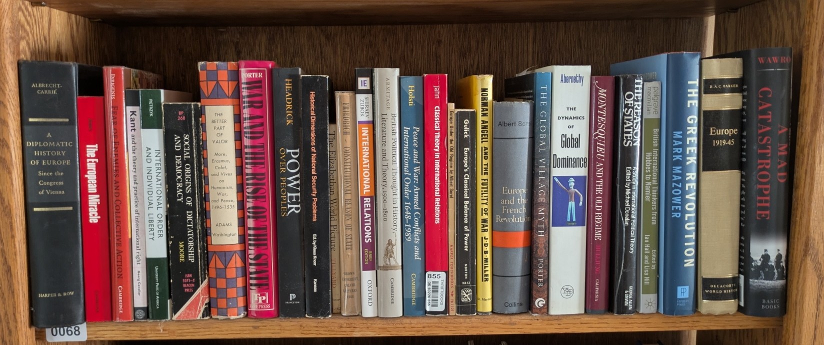 Photograph of Shelf 68; books are listed in top-to-bottom order alongside the photograph.
