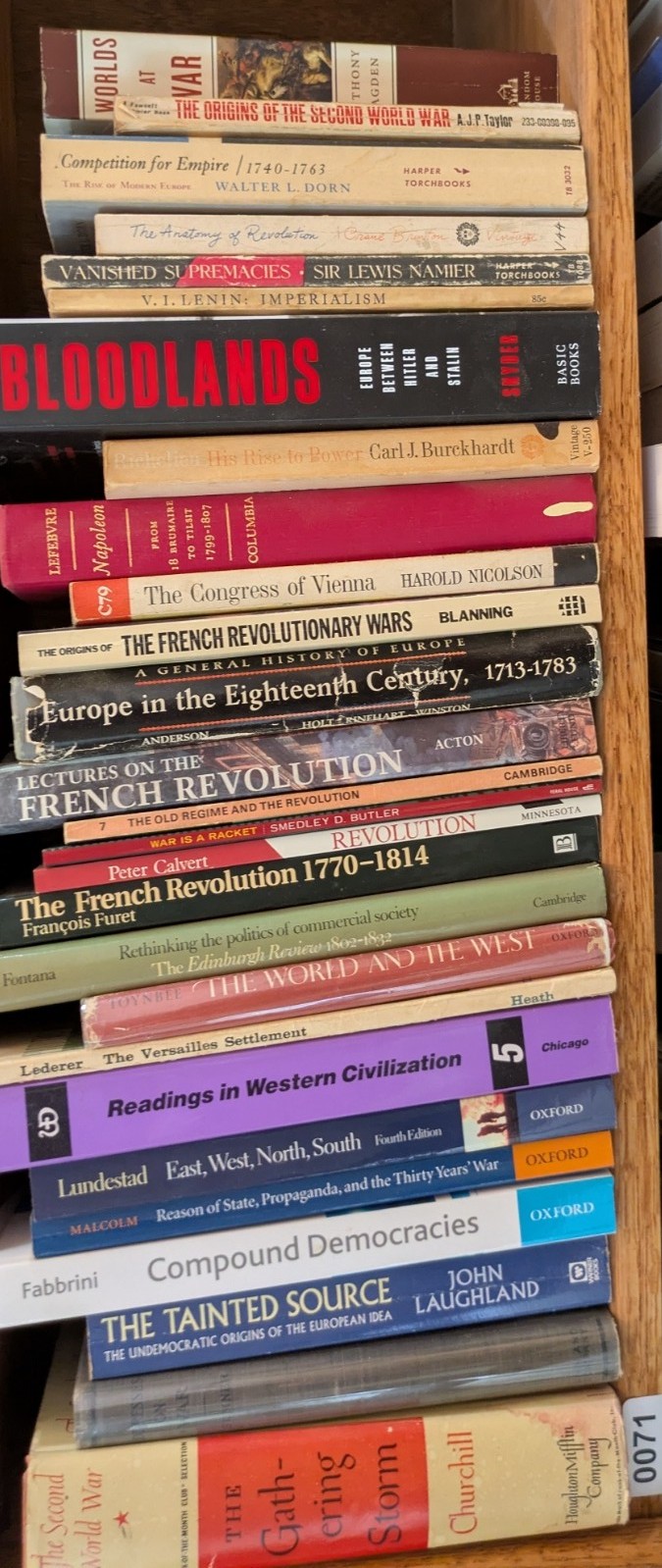 Photograph of Shelf 71; books are listed in top-to-bottom order alongside the photograph.
