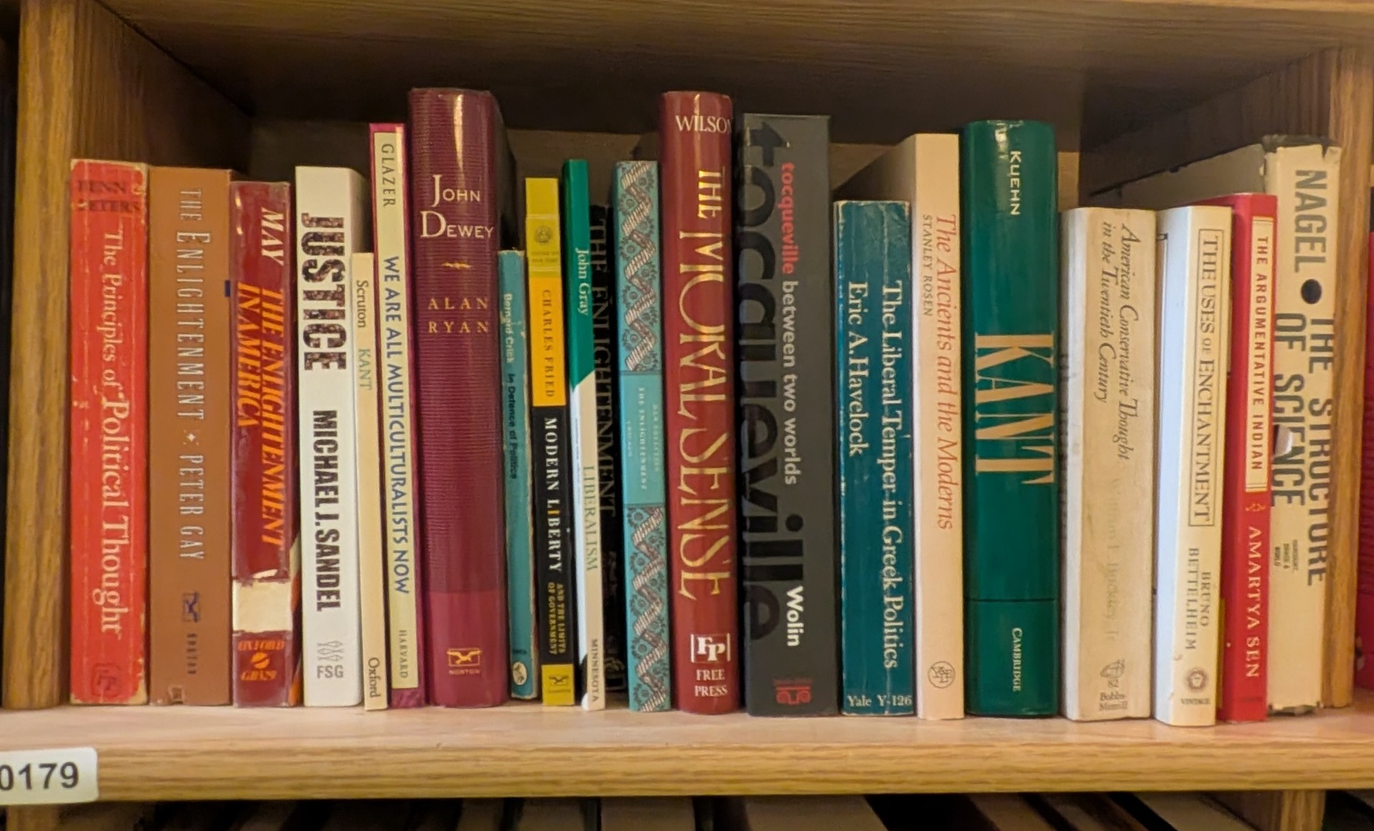Photograph of Shelf 179 with readable book spines.
