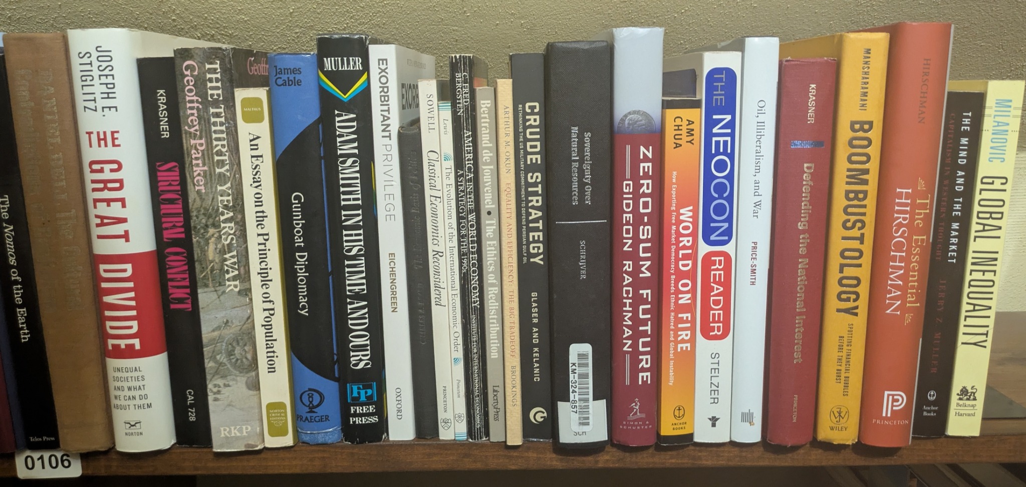 Photograph of Shelf 106; books are listed in top-to-bottom order alongside the photograph.