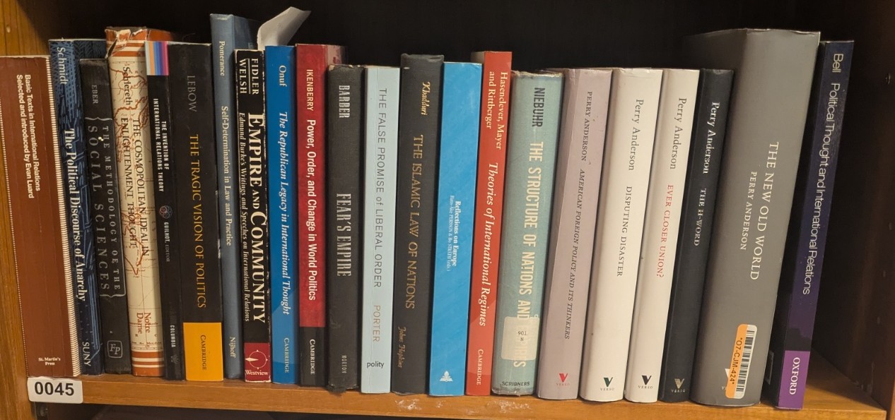 Photograph of Shelf 45; books are listed in top-to-bottom order alongside the photograph.