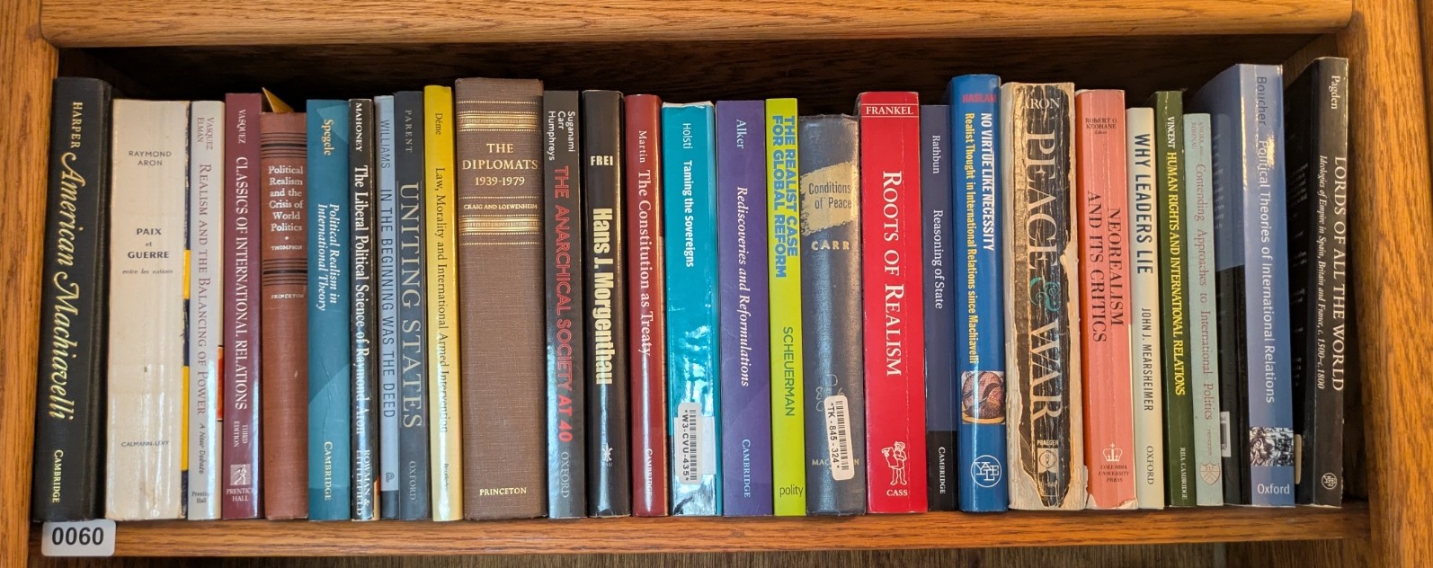 Photograph of Shelf 60; books are listed in top-to-bottom order alongside the photograph.