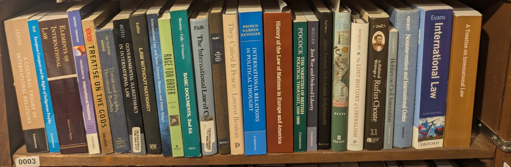 Photograph of Shelf 3; books are listed in top-to-bottom order alongside the photograph.