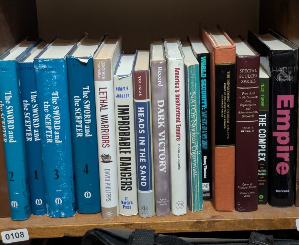 Photograph of Shelf 108; books are listed in top-to-bottom order alongside the photograph.