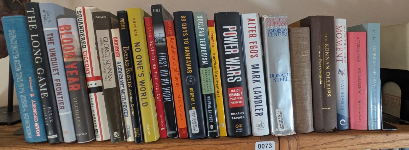 Photograph of Shelf 73; books are listed in top-to-bottom order alongside the photograph.