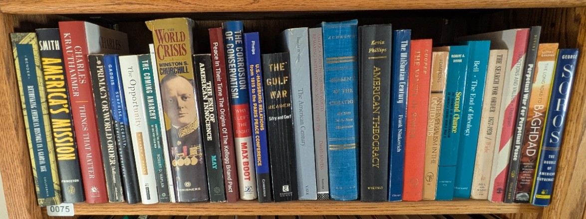 Photograph of Shelf 75; books are listed in top-to-bottom order alongside the photograph.