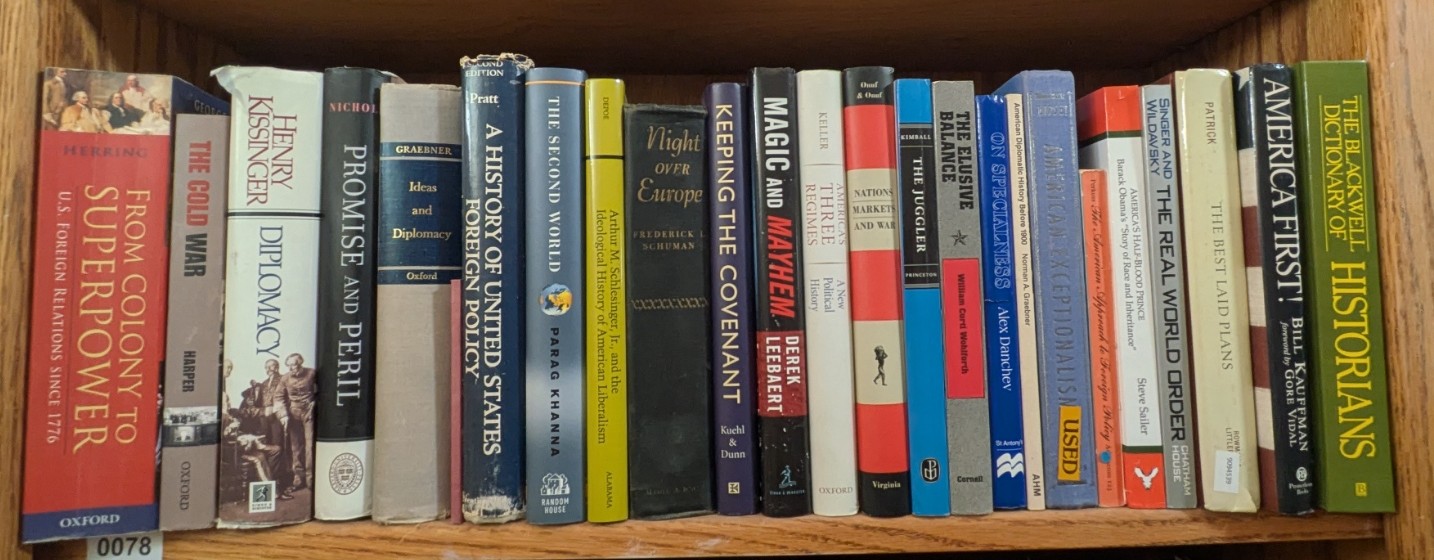 Photograph of Shelf 78; books are listed in top-to-bottom order alongside the photograph.