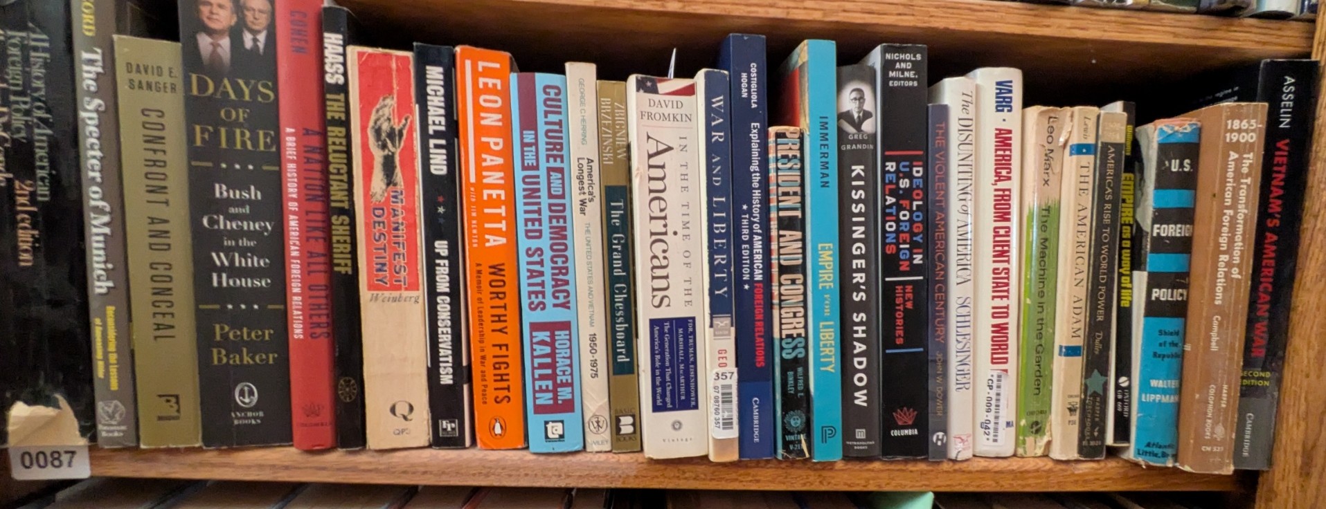 Photograph of Shelf 87; books are listed in top-to-bottom order alongside the photograph.