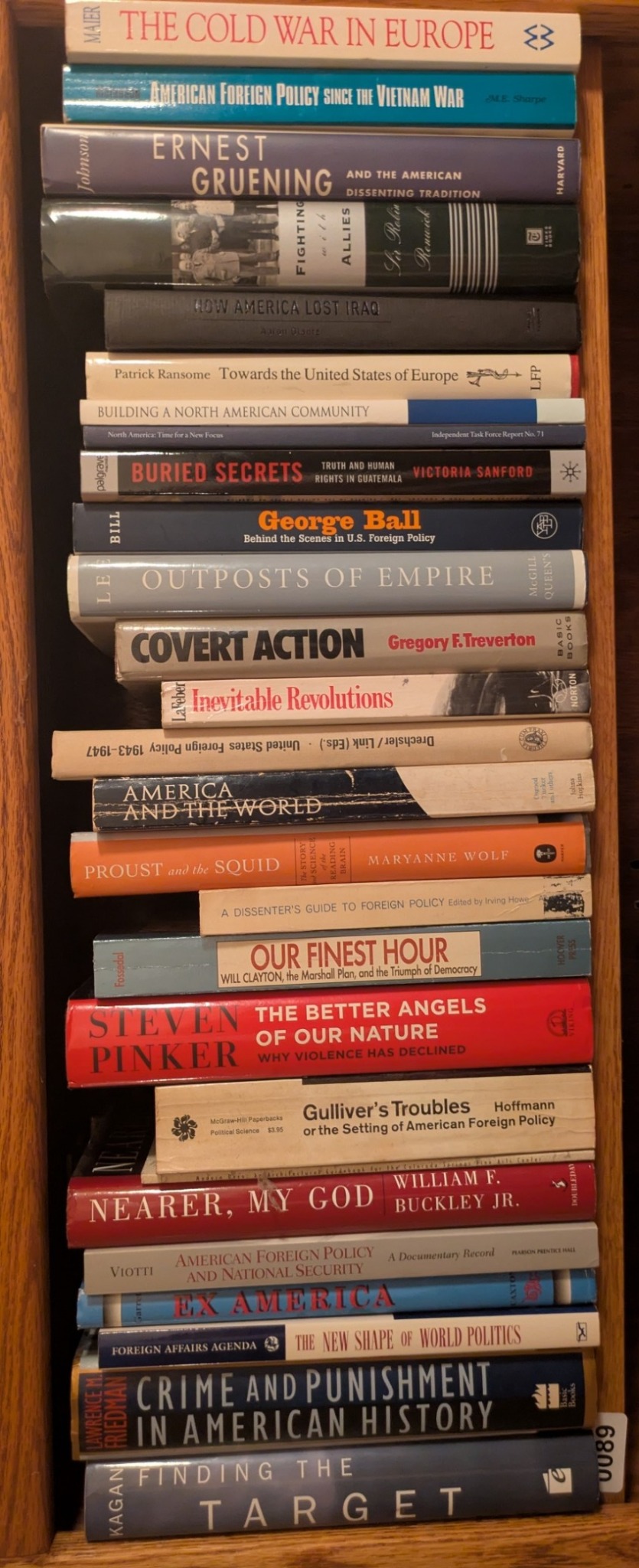 Photograph of Shelf 89; books are listed in top-to-bottom order alongside the photograph.