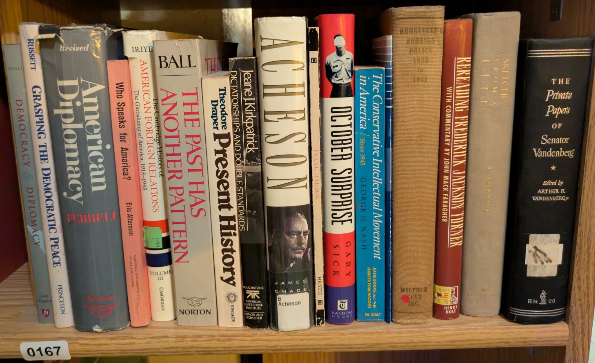 Photograph of Shelf 167; books are listed in top-to-bottom order alongside the photograph.