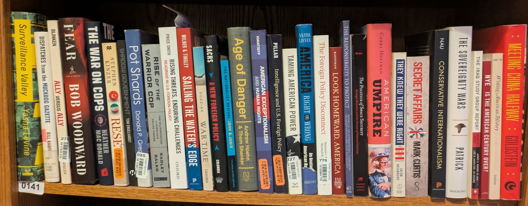 Photograph of Shelf 141; books are listed in top-to-bottom order alongside the photograph.