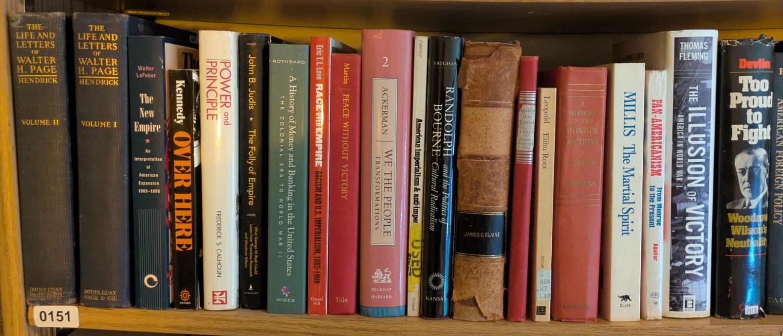 Photograph of Shelf 151; books are listed in top-to-bottom order alongside the photograph.
