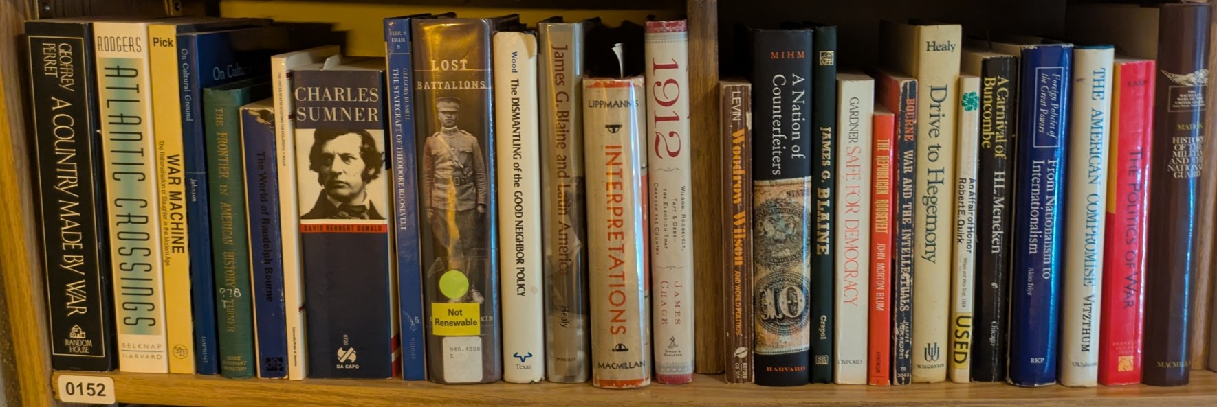 Photograph of Shelf 152; books are listed in top-to-bottom order alongside the photograph.