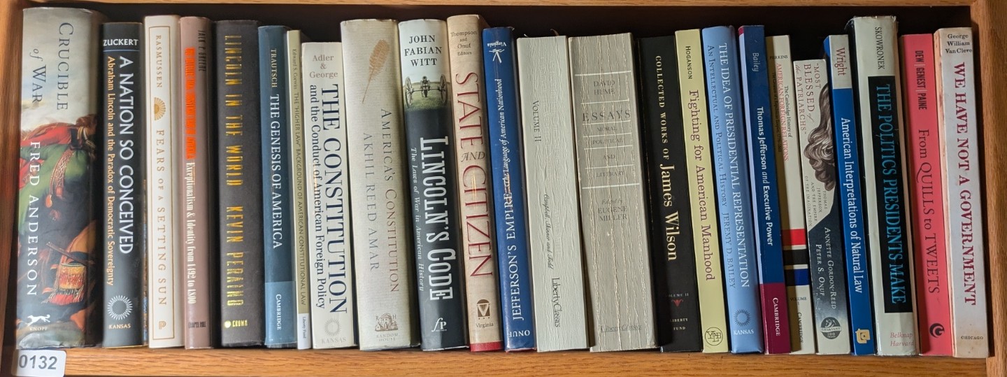 Photograph of Shelf 132; books are listed in top-to-bottom order alongside the photograph.
