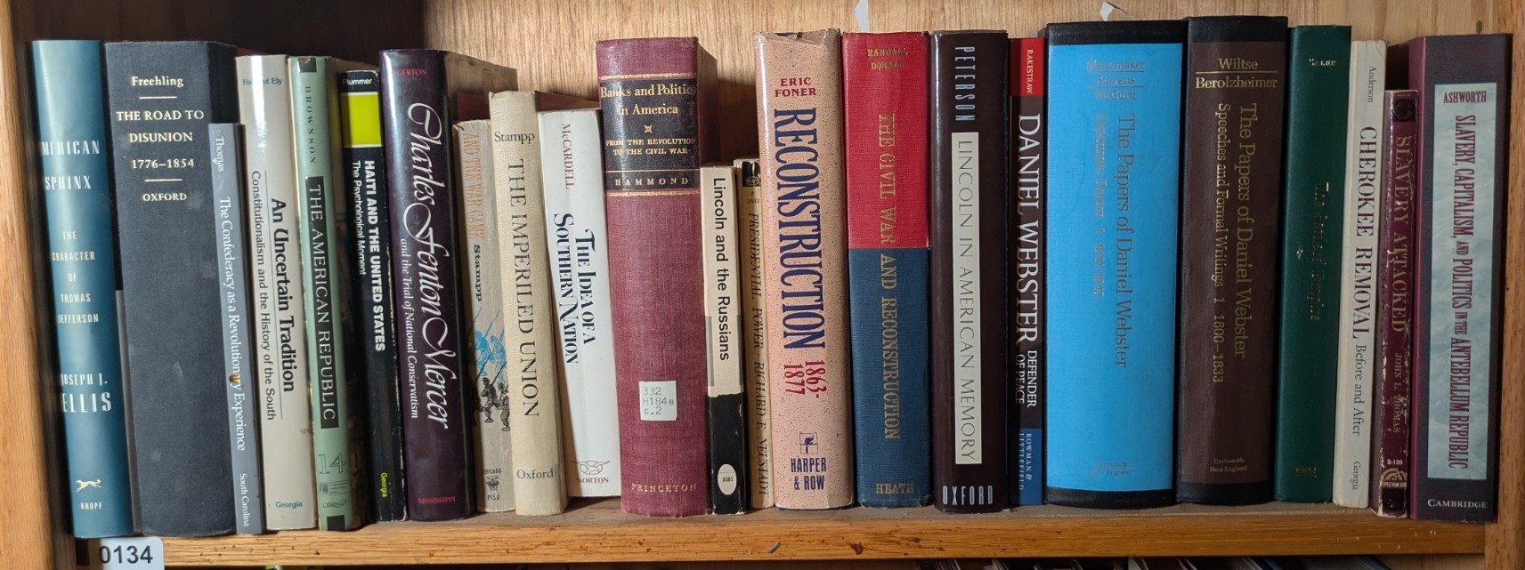 Photograph of Shelf 134; books are listed in top-to-bottom order alongside the photograph.