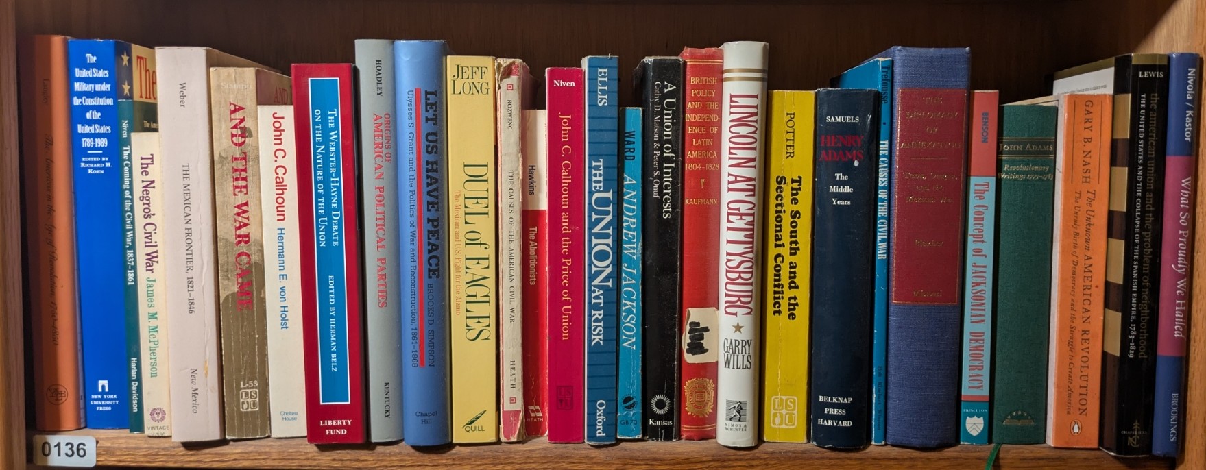 Photograph of Shelf 136; books are listed in top-to-bottom order alongside the photograph.