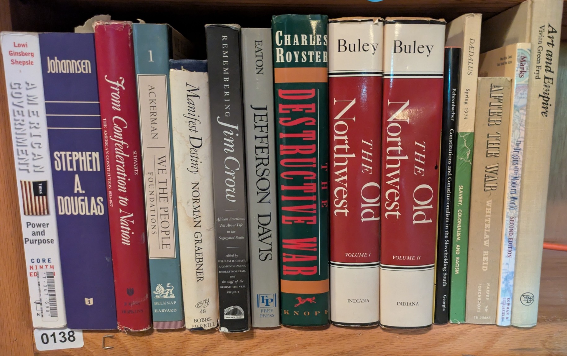 Photograph of Shelf 138; books are listed in top-to-bottom order alongside the photograph.