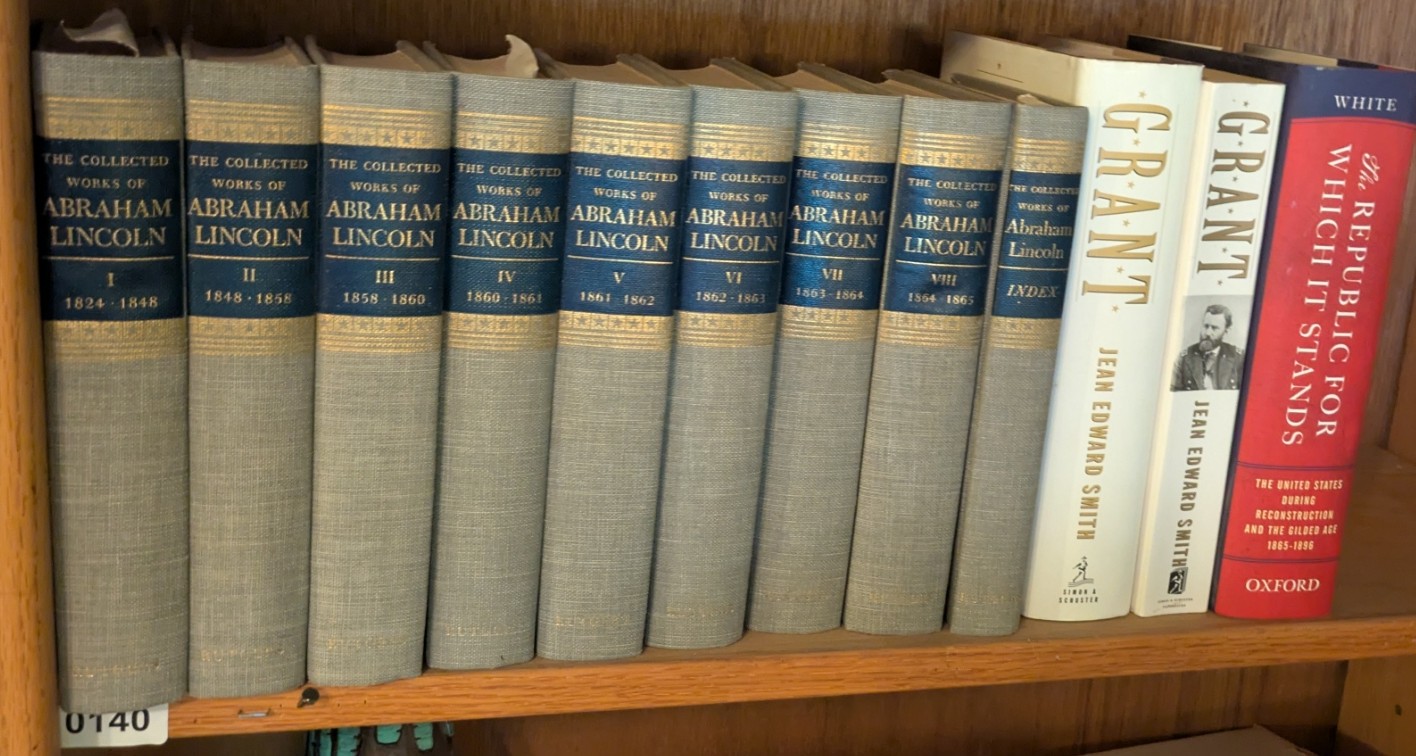 Photograph of Shelf 140; books are listed in top-to-bottom order alongside the photograph.