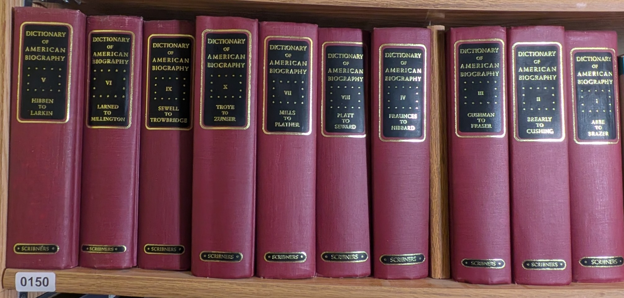 Photograph of Shelf 150; books are listed in volume-number order below the photograph.